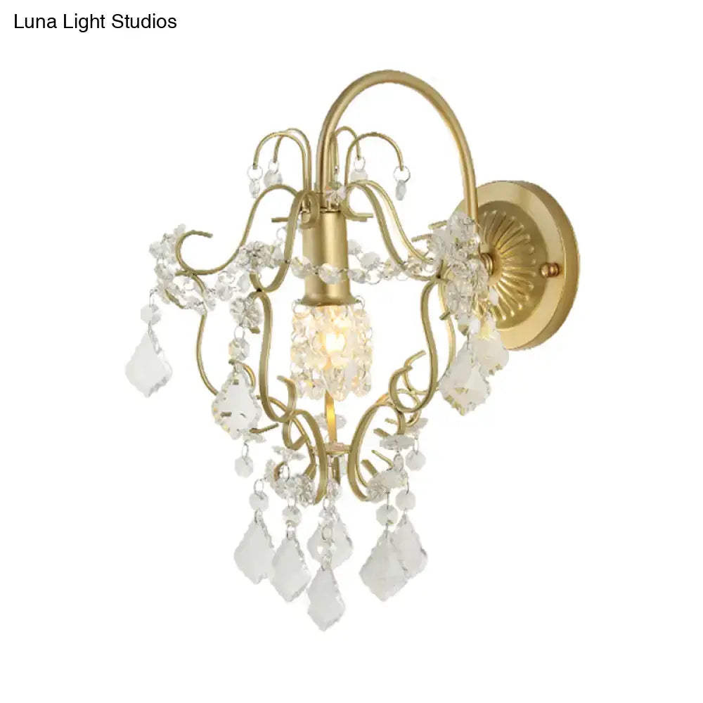 Rustic gold crystal wall mount lamp with clear crystal droplets and ornate decorative elements for bedroom lighting