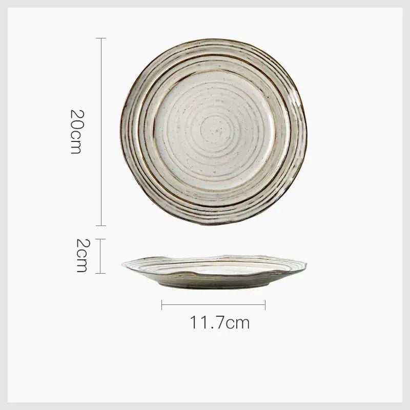 Rustic grayish white ceramic dish bowl set with concentric ridges, matte glaze, brown speckles, and darker rim bands