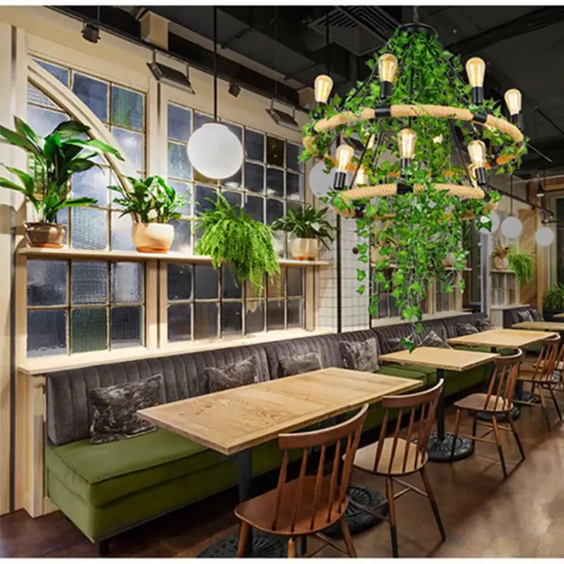 Rustic green leaf chandelier with woven wooden rings and cascading ivy perfect for bar or dining room lighting