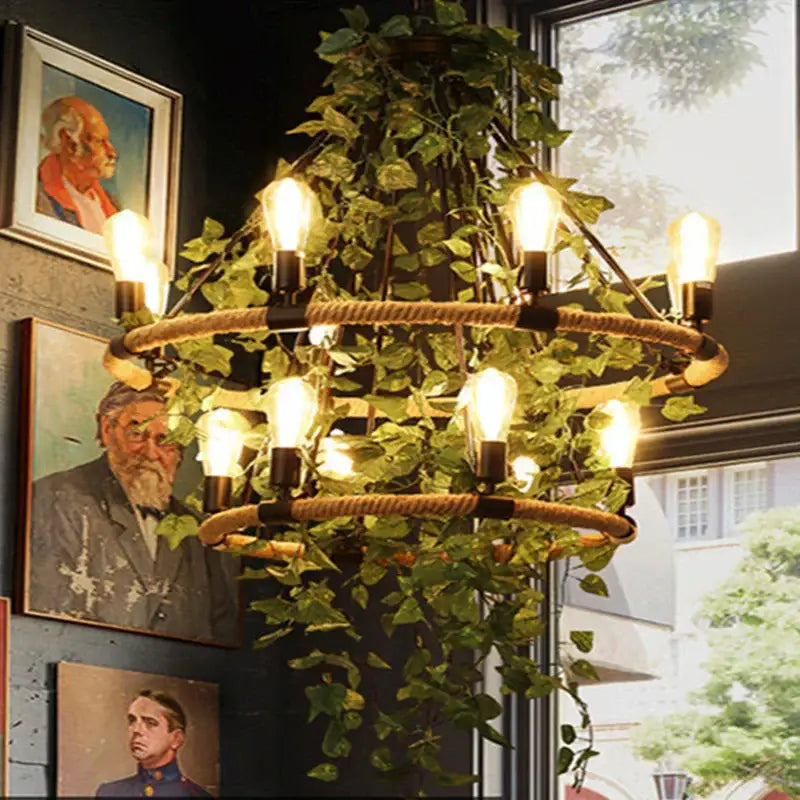Rustic green leaf chandelier with two-tiered rope rings, hanging ivy, and exposed edison bulbs for bar dining room