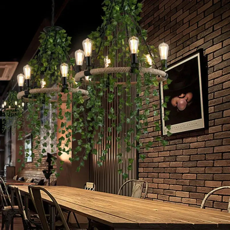 Industrial-style green leaf chandelier with natural-fiber rope frame and exposed edison bulbs for bar dining room