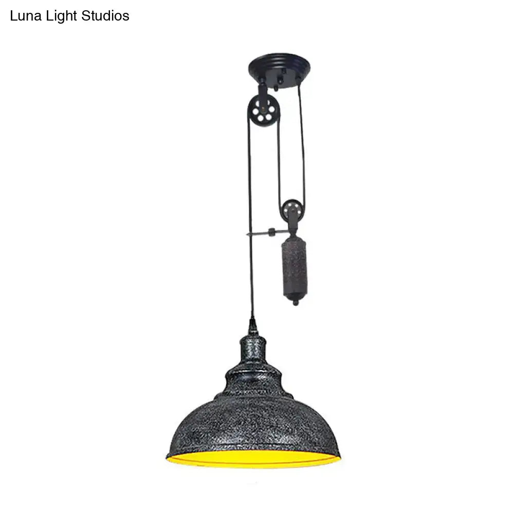 Industrial dome pendant lamp by decorbites with black textured metal shade yellow interior and adjustable pulley system