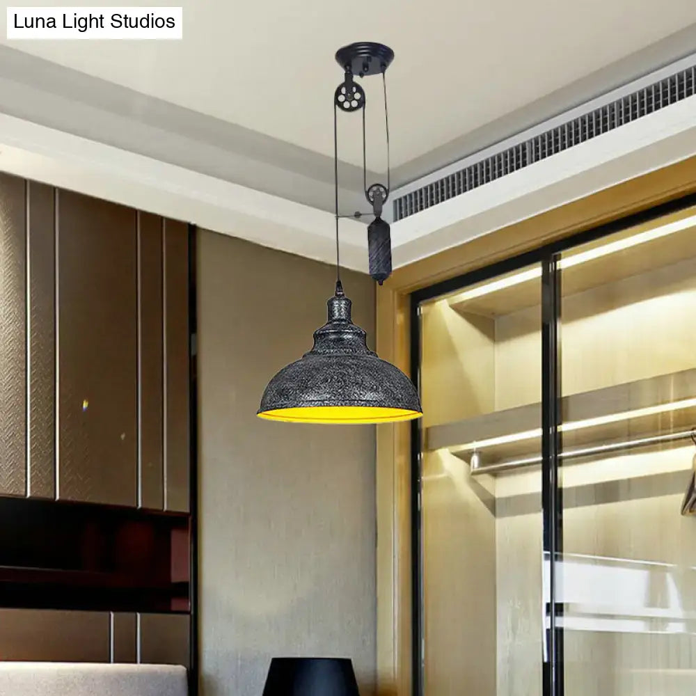 Decorbites rustic industrial dome pendant lamp in black metal with etched detailing and warm yellow interior for living room lighting