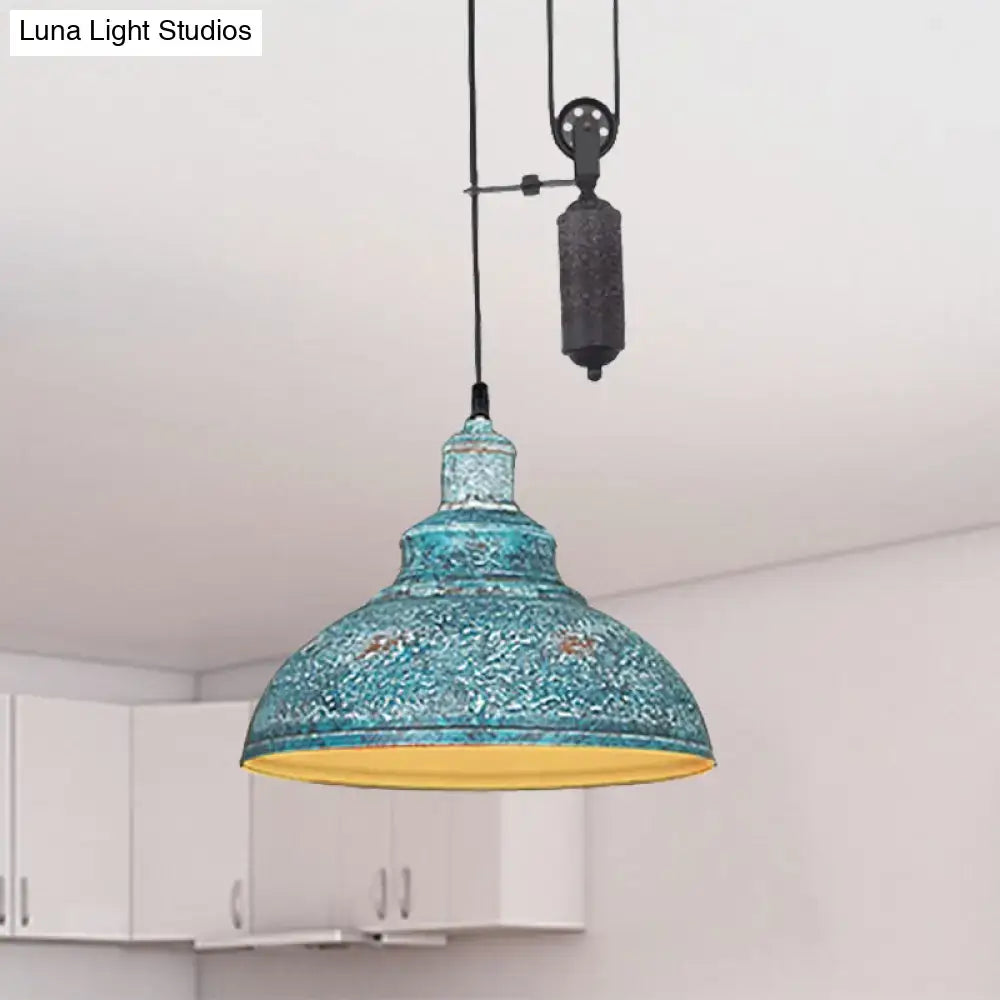 Teal mosaic-patterned rustic industrial dome pendant light with yellow interior and metal pull chain for living room lighting