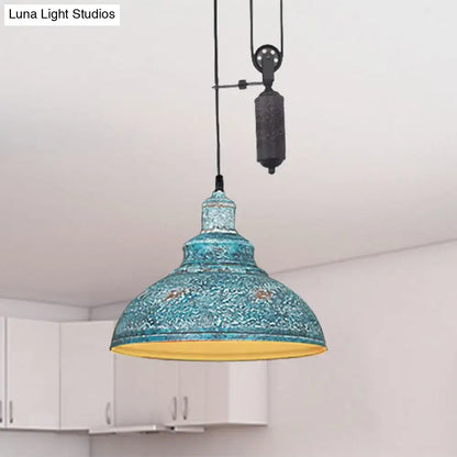 Teal mosaic-patterned rustic industrial dome pendant light with yellow interior and metal pull chain for living room lighting