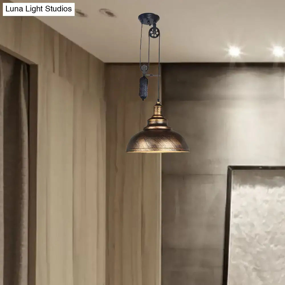 Rustic industrial dome pendant lamp with brass pulley mechanism and dark metal accents for living room lighting