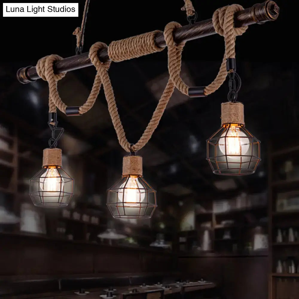 Rustic industrial hemp rope pendant lamp with three exposed bulbs in wire cages suspended by rope from dark wood beam
