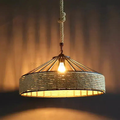Warm-toned rustic industrial pendant light with hemp rope woven shade and braided cord installation method