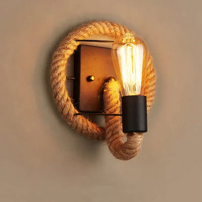 Rustic industrial hemp rope wall lamp with black metal base and exposed filament bulb for decorbites hemp rope decor