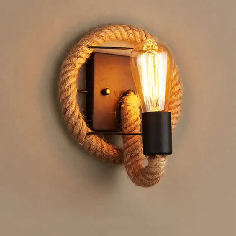 Rustic industrial hemp rope wall lamp with black metal base and exposed filament bulb for decorbites hemp rope decor