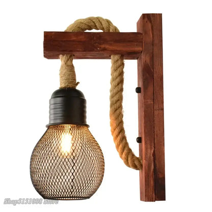 Rustic industrial hemp rope wall lamp with dark wood frame beige rope suspension and black mesh bulb cage decorbites hemp rope