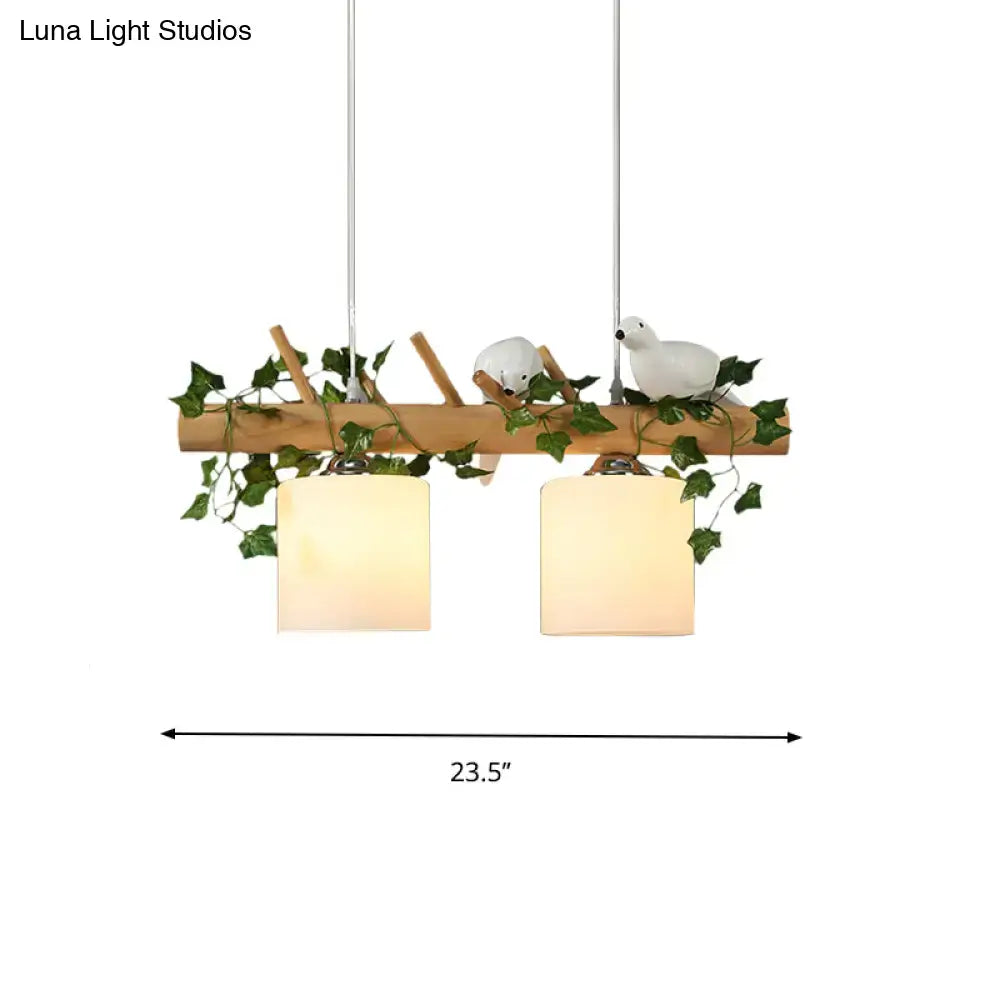 Decorbites™ ivory glass wood island pendant with two frosted glass shades, maple green leaf, and ceramic bird décor