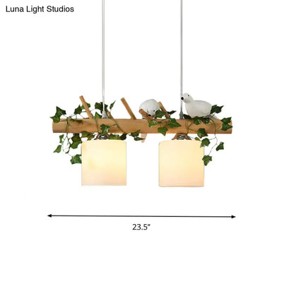 Decorbites™ ivory glass wood island pendant with two frosted glass shades, maple green leaf, and ceramic bird décor