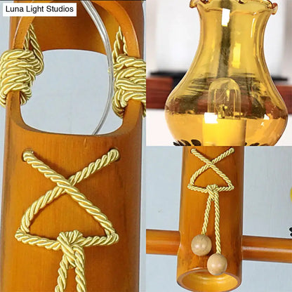 Decorbites™ retro black yellow pendant light with warm amber glass lantern, bamboo frame, and golden rope kerosene island light