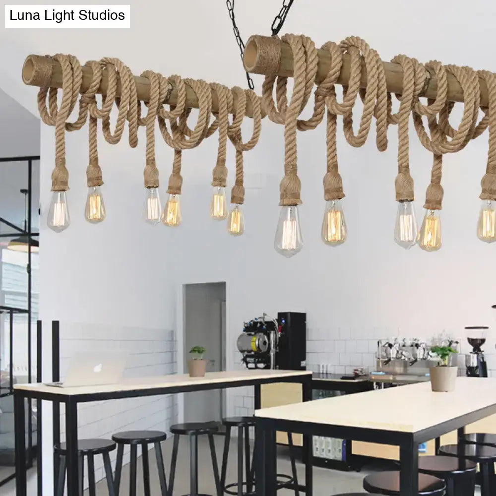 Rustic industrial beige island light with adjustable natural fiber rope and bamboo dowels featuring clear filament bulbs