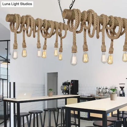 Rustic industrial beige island light with adjustable natural fiber rope and bamboo dowels featuring clear filament bulbs