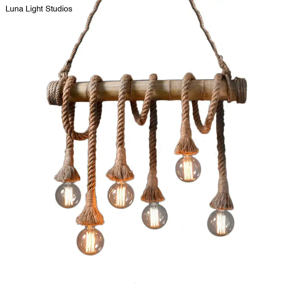 Rustic beige bamboo island light by decorbites™ featuring thick braided rope and frayed tassel cords with open bulbs