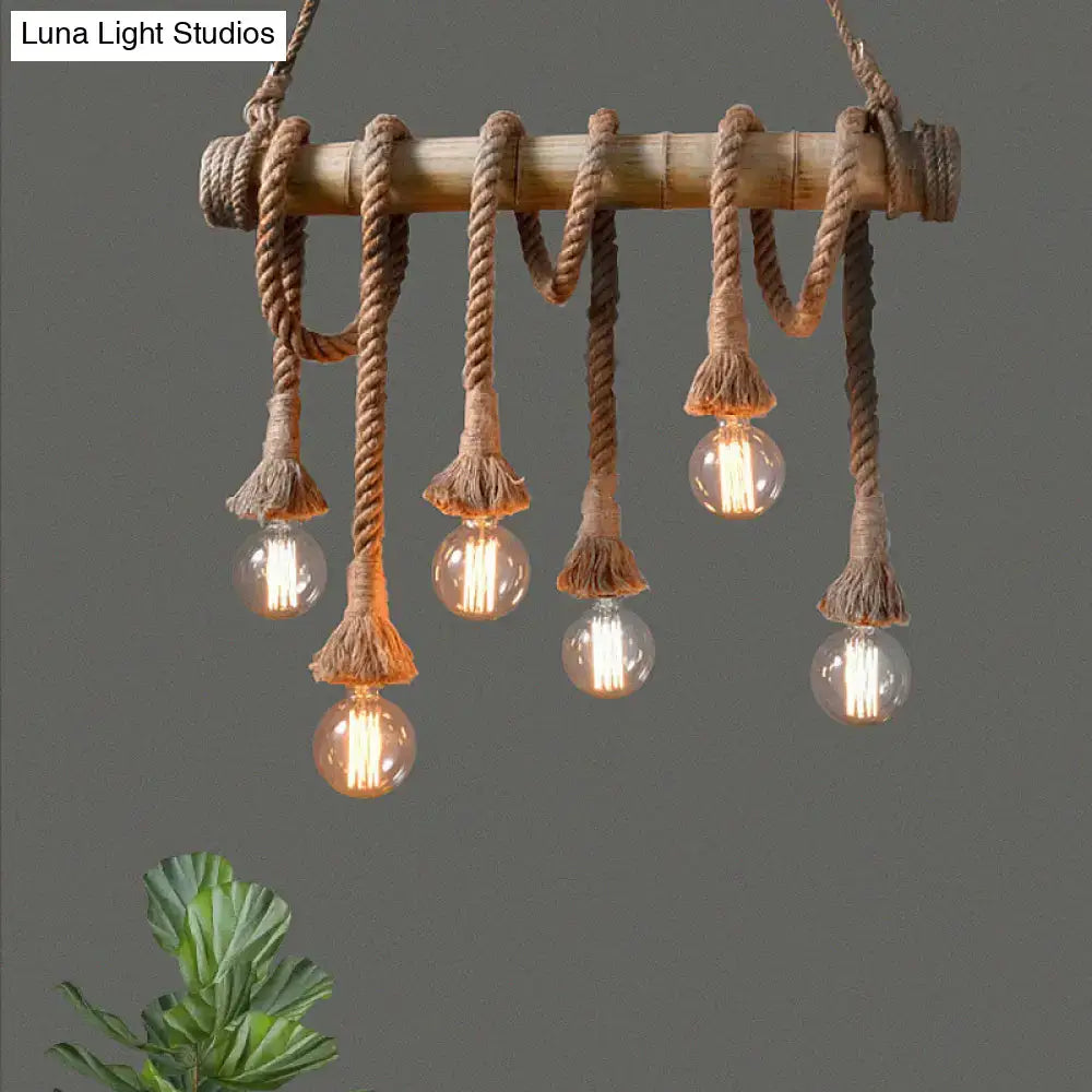 Rustic bamboo island light with beige rope and five clear glass bulbs in decorbites lodge industrial style
