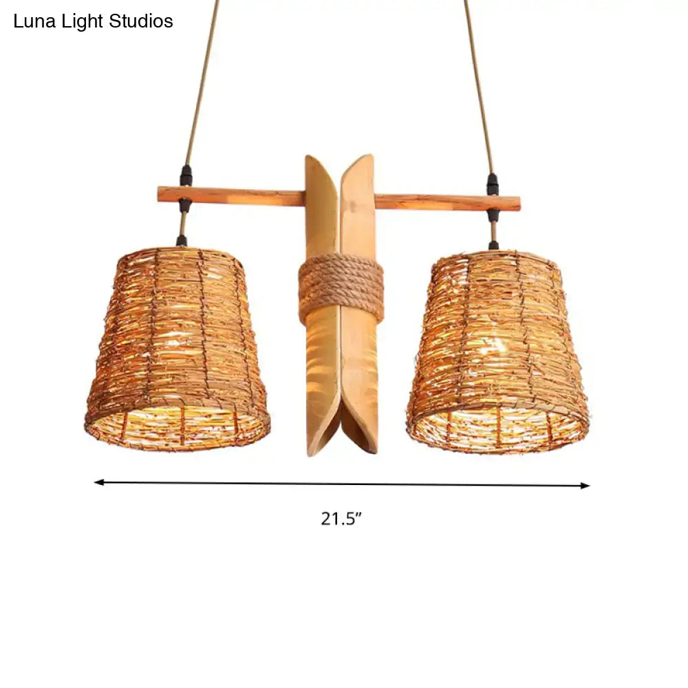 Natural woven rattan pendant light fixture with two warm-toned cone shades, wooden crossbar, and bamboo design