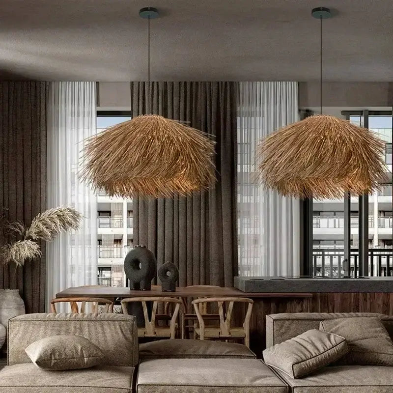 Two hanging pendant lights with natural straw shade in warm golden-brown tones to bring warmth to dining rooms