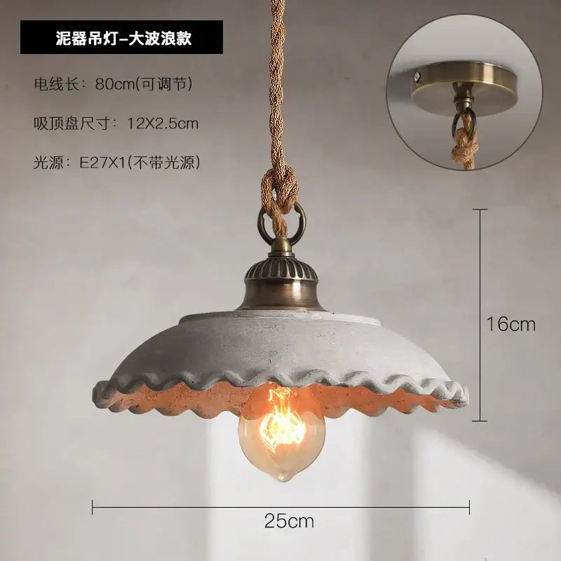 Rustic off white ceramic pendant light with scalloped edge brass hardware and twisted rope suspension cement loft style