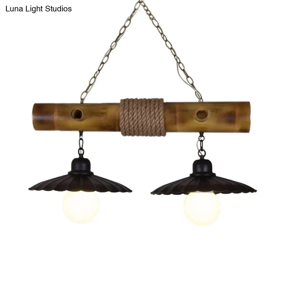Rustic scalloped hanging lamp with bamboo and black rope wrap featuring two black flared shades for dining room lighting