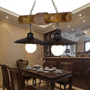 Decorbites scalloped hanging lamp with two black metal shades and rope-wrapped bamboo for dining room lighting