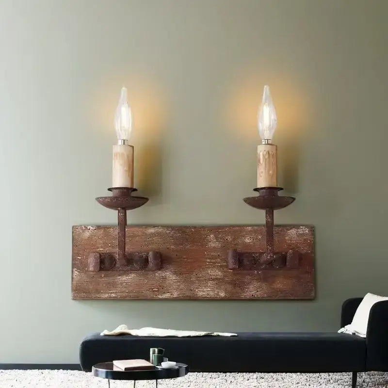 Rustic solid wood wall light with two wrought iron candle sconce fixtures and exposed filament bulbs for bedroom decorbites country retro style