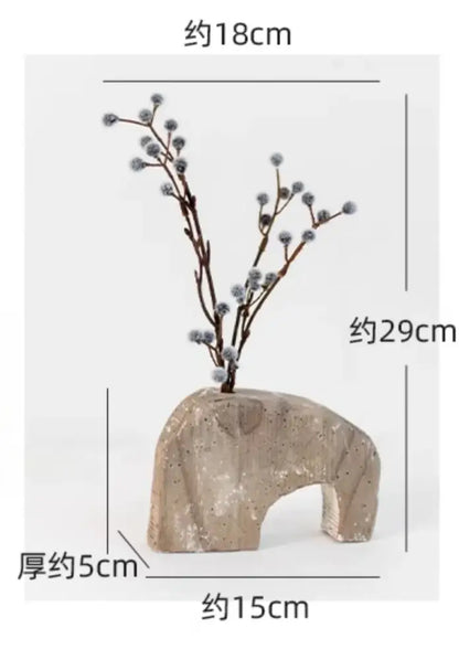 Beige textured stone elephant-shaped hydroponic vase with naturalistic design and subtle speckles for decorbites garden rattan
