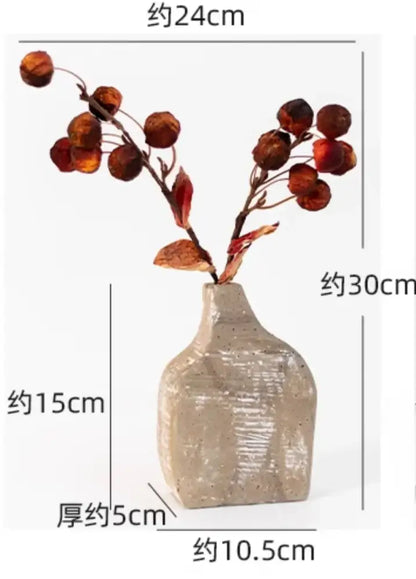 Rustic speckled gray ceramic hydroponic vase with textured surface holding dried branches for decorbites garden rattan use