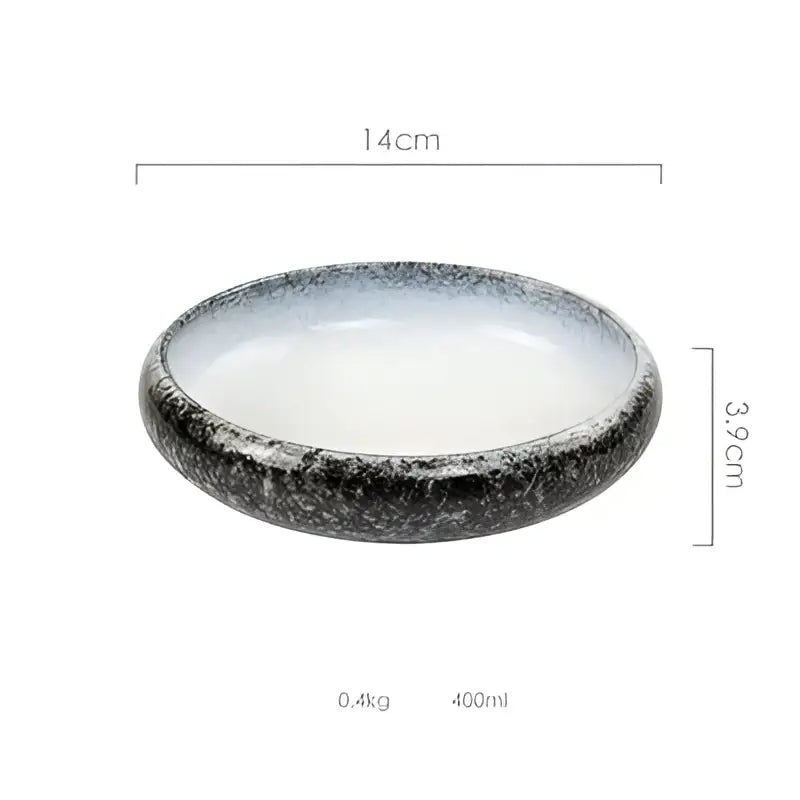 A sleek 14cm wide rustic speckled white and black ceramic kimchi plate with a black and white glaze finish