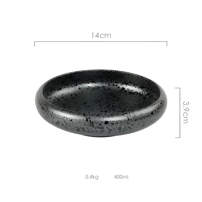 Black speckled ceramic kimchi plate with glossy finish and rounded edges for rustic dining room use