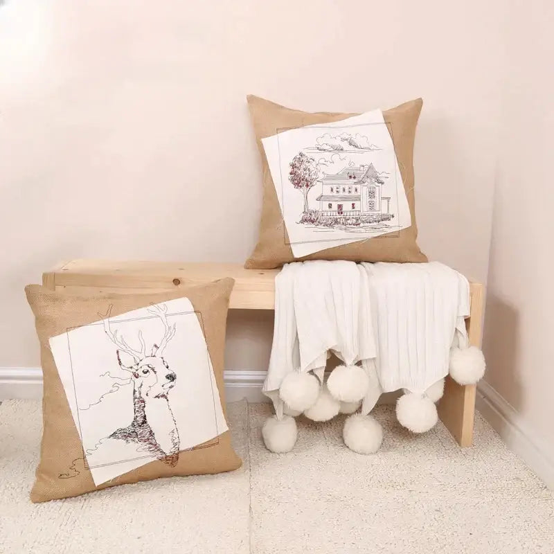 Rustic tan burlap pillow cover with black and white embroidered fashion pillow designs of deer and house panels