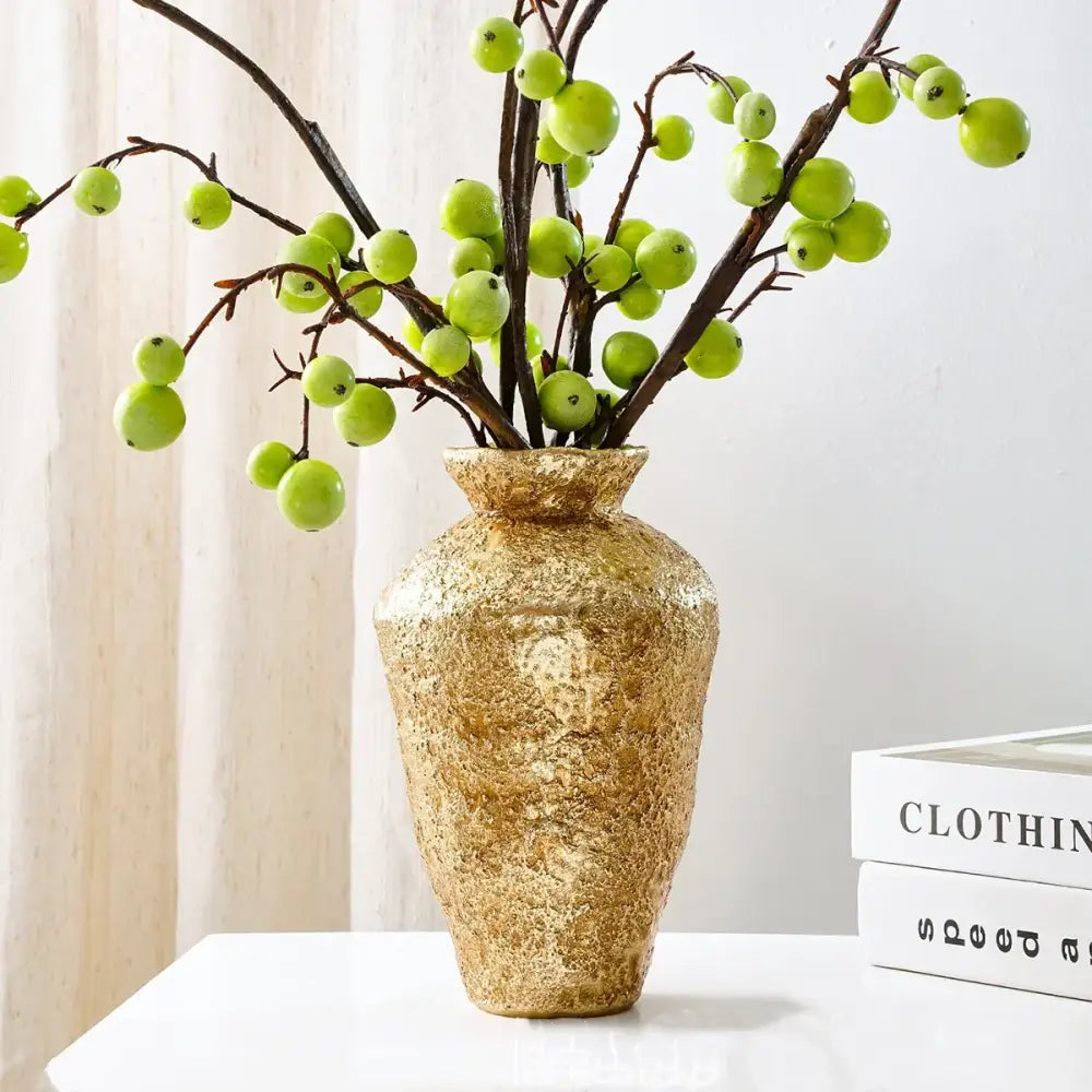 Golden textured ceramic vase resin handicraft holding green berry branches for living room decorbites golden vase