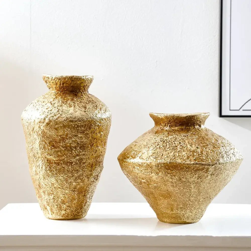 Two textured gold-colored ceramic vases with a rustic handcrafted finish ideal for decorbites golden vase resin handicraft decor