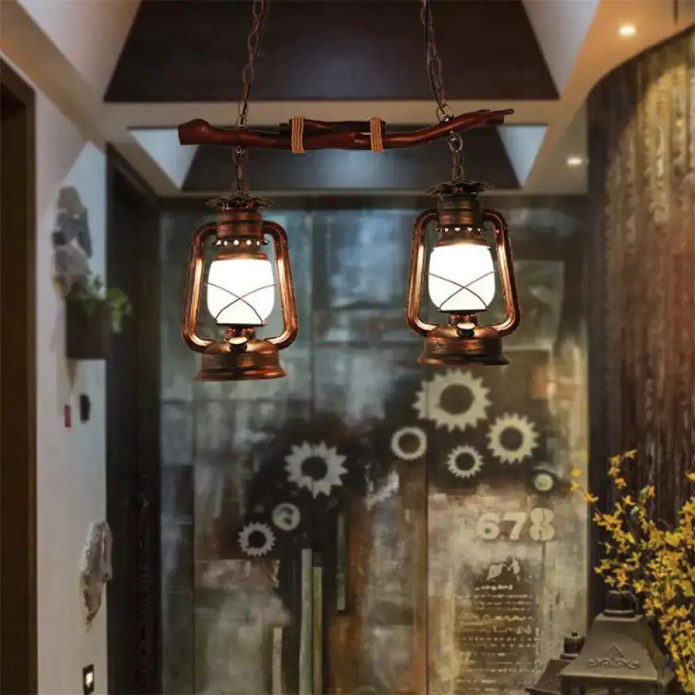 Rustic vintage aged copper 2-light lantern pendant by decorbites hanging from wooden branch ideal as island lamp