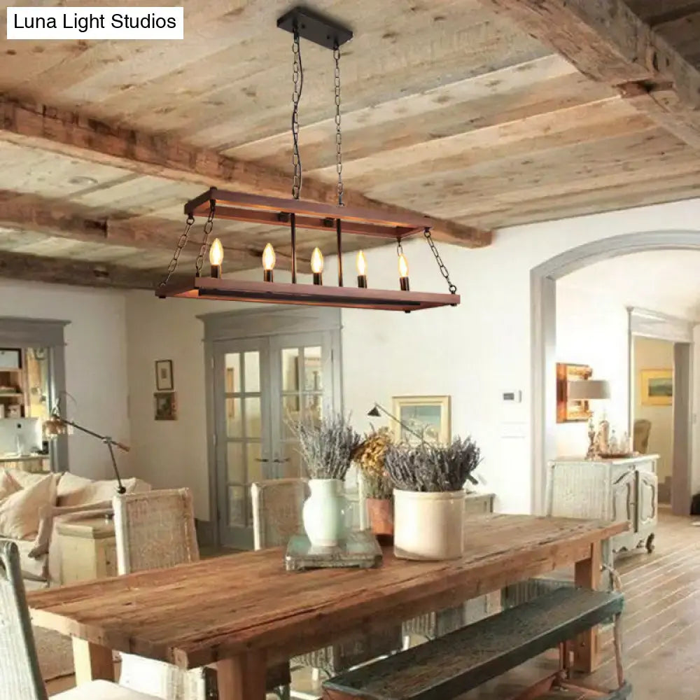 Rustic vintage brown wood chandelier with five exposed bulbs suspended by dark metal chains for dining room island light