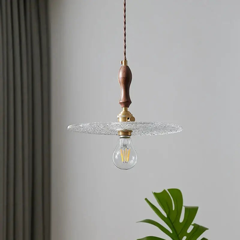 Rustic walnut and brass cullet glass led pendant with dark wood handle and clear textured glass for dining room decorbites