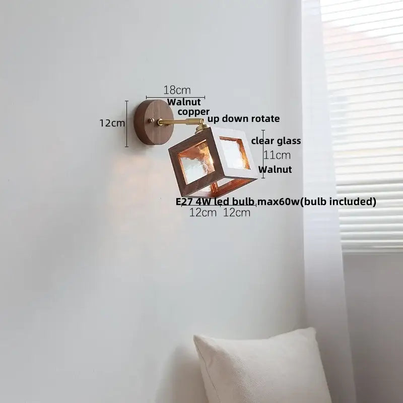 Rustic walnut and copper wall light fixture with a clear glass cube for bedroom use