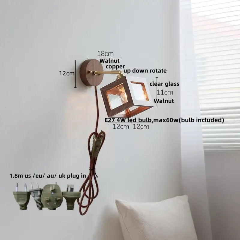 Rustic walnut and copper wall light fixture with clear glass cube for bedroom lighting with brass accents