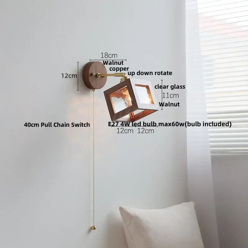 Rustic walnut and copper wall light fixture with clear glass panels for bedroom sconce illumination