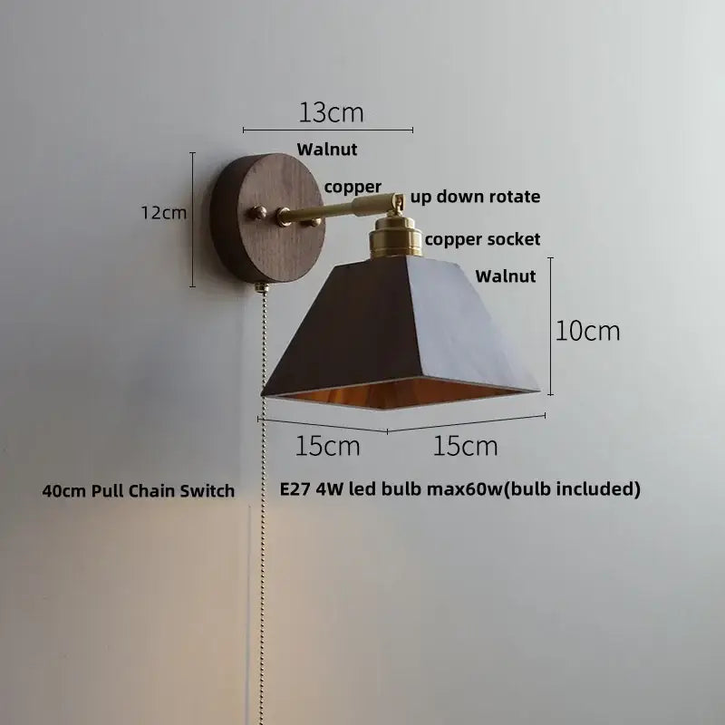 Rustic walnut and brass wall light fixture with a walnut base copper arm and black geometric shade for bedroom use