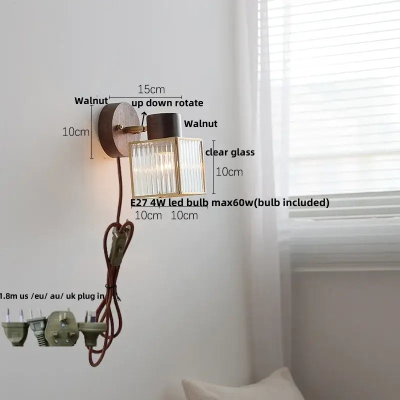 Rustic walnut and brass led wall lamp with adjustable up-down rotation and textured clear glass shade for bedroom use