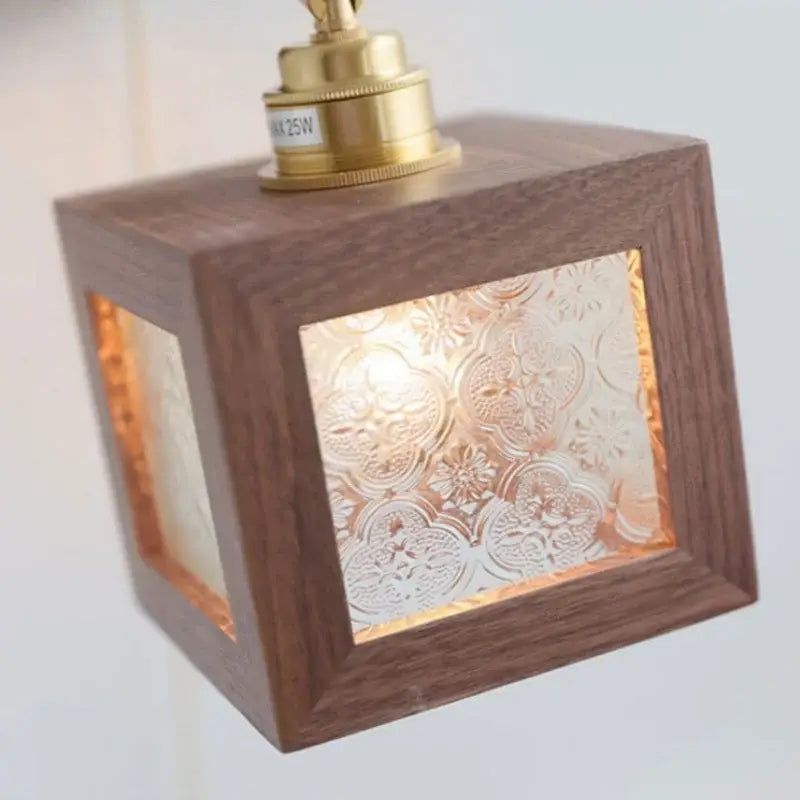 Rustic walnut wood and brass wall sconce with warm wooden cube and frosted floral glass panels by decorbites led