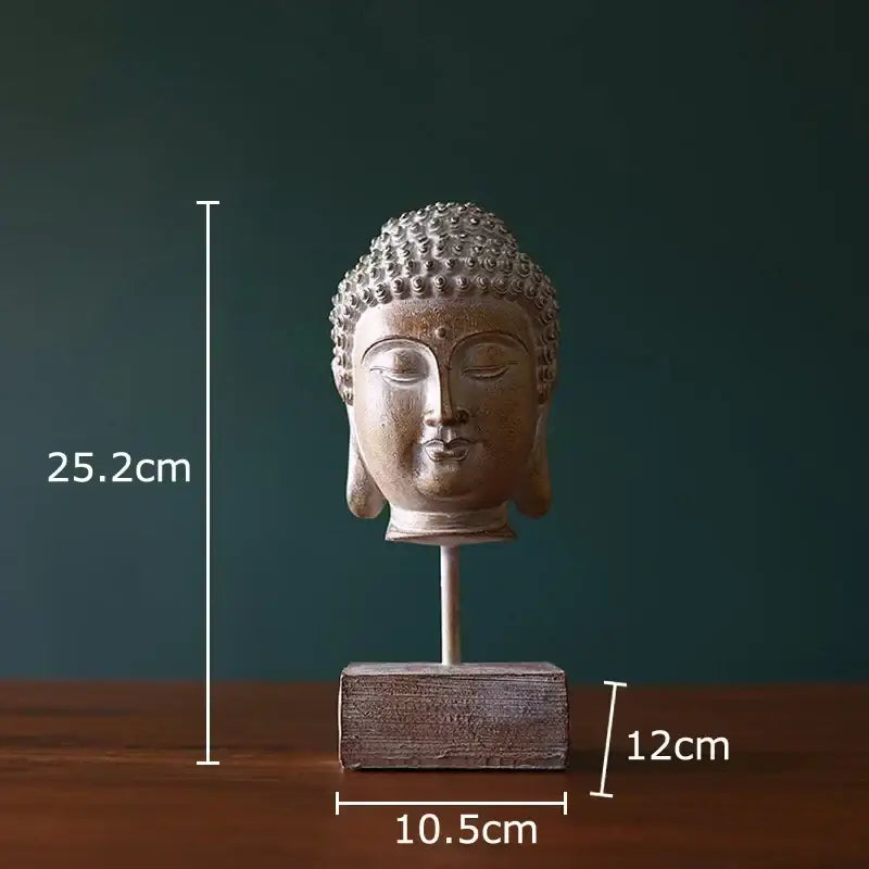 Rustic weathered bronze buddha head statue with detailed ushnisha on a wooden base for living room decor