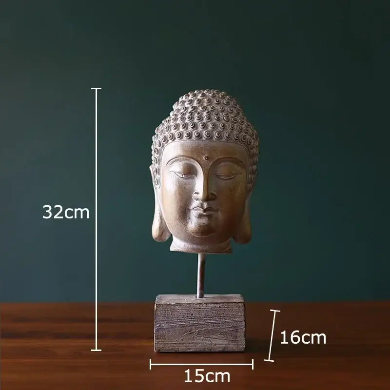 Bronze-colored buddha head statue with detailed curly hair on a rustic wooden base for living room decor