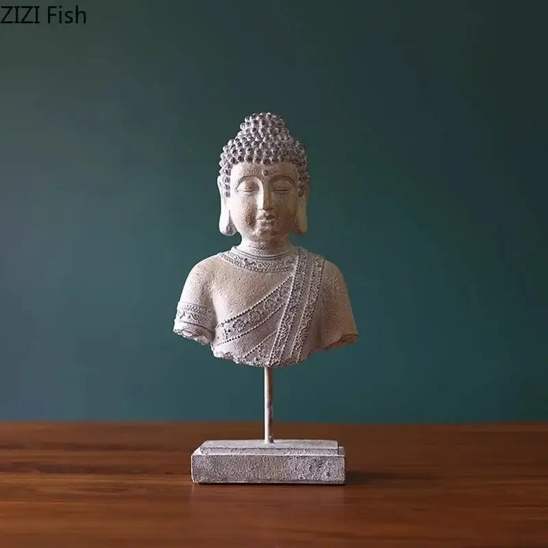 Rustic weathered bronze buddha head statue featuring a silver-toned resin buddha head bust with detailed robes on a rectangular base