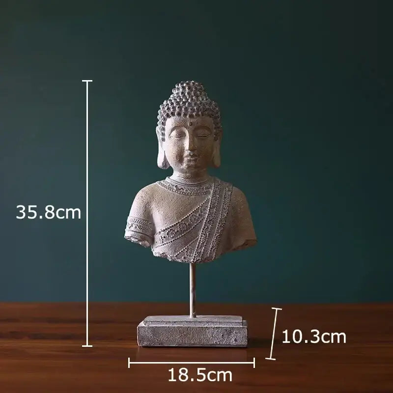 Rustic weathered bronze buddha head statue with intricate gray stone detailing on rectangular base for living room decor