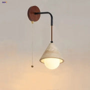 Rustic white concrete and wood wall light fixture with matte white conical shade and black metal arm for bedroom