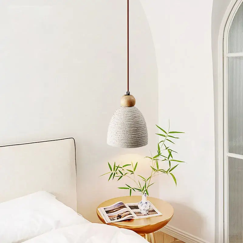 Textured gray concrete cement pendant light with wooden top and dark cord for rustic dining room decorbites pendant lights